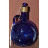 A 19th century Bristol blue glass decanter and stopper with brass collar detail, 20cm high