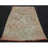 A vintage hand-woven wall hanging, the abrashed orange ground decorated with rows of lozenge-