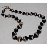 A bullseye banded agate necklace