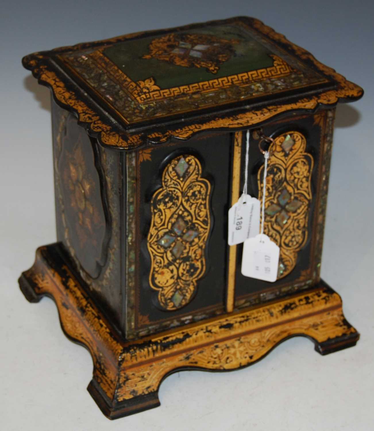 Royal Interest - A Victorian papier maché black lacquer and mother of pearl inlaid tabletop cabinet,
