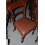 A set twenty Victorian mahogany balloon back dining chairs with brown rexine upholstery