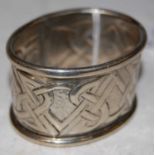 A Glasgow school white metal oval shaped napkin ring bearing initials 'MJ', possibly that of