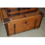 A metal bound wooden storage trunk