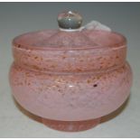 Attributed to Monart, a circular dressing table box and cover, mottled and pink and clear glass with