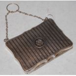 A vintage Birmingham silver evening purse, the covers with engine turned details and circular