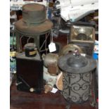 A collection of various lights and lanterns to include a vintage carriage lantern, a vintage bike