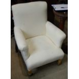 A 19th century gilt wood armchair upholstered in white calico on tapered cylindrical supports with