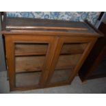 A 20th century pine cabinet top with double glazed arched doors, together two other cabinet tops