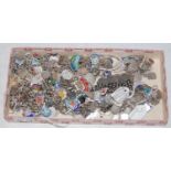 Ten assorted white metal and enamel charm bracelets, the charms predominantly inscribed 'silver',