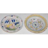 Two English Delft pottery dishes, late 18th/ early 19th century, both decorated in the Fazackerley