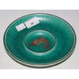 Gustavsberg, an early 20th century green glazed ceramic dish with silvered swordfish decoration,