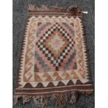 A small Kilim flatweave rug, 20th century, the rectangular field with geometric design of concentric