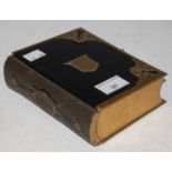 A Victorian brass mounted portrait photograph album with various photographic cards, Thomas