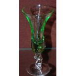A green and clear liqueur glass with twisted stem, 13cm high.