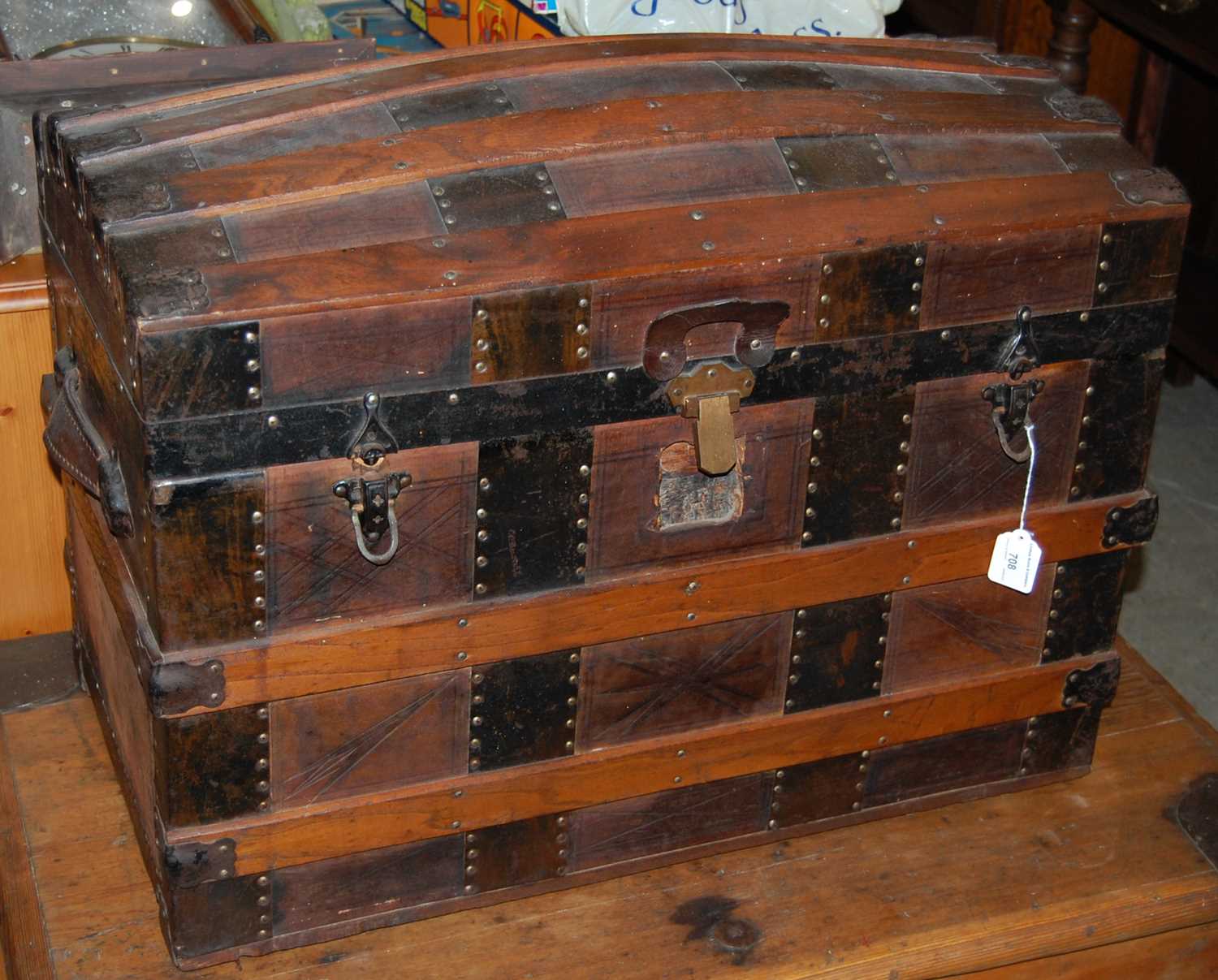 A wood and metal bound dome top trunk