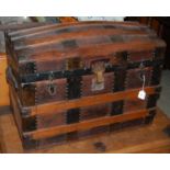 A wood and metal bound dome top trunk