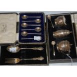 A Birmingham silver cased fork and spoon, together with a cased set of six Sheffield silver coffee