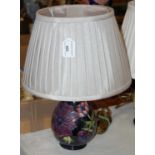 A Moorcroft table lamp, the blue ground decorated with the anemone pattern