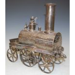 An unusual 19th century electroplated presentation decanter in the form of a steam train with