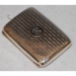 A Birmingham silver cigarette case with engine turned covers and engraved initial panel, 2.8 troy