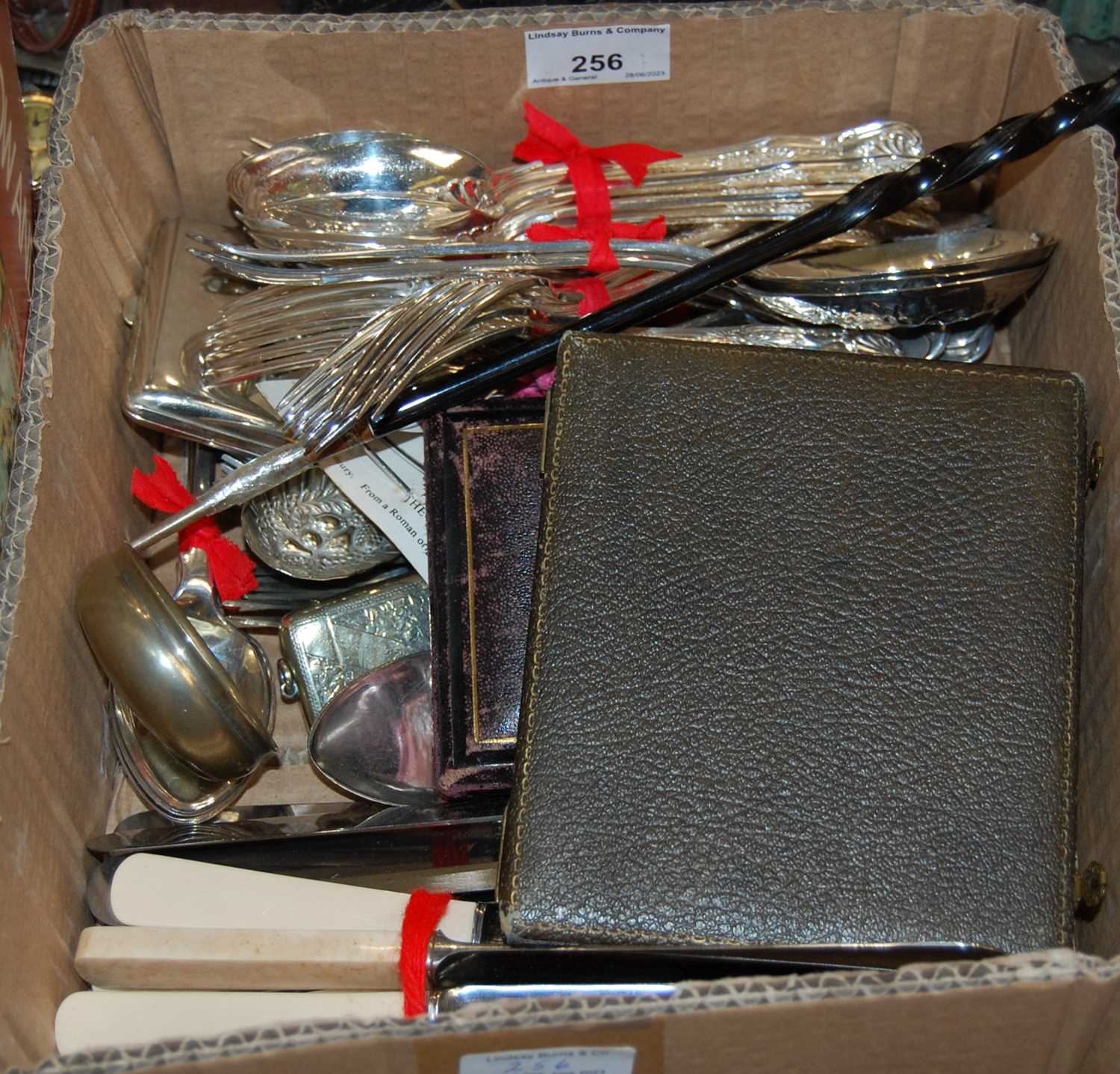 A box containing EP and other metal flatware, together with a cased set of lobster crackers, a cased