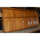 A vintage Ercol wall shelf with asymetric shelving space, 106.5cm wide x 49cm high
