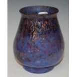 A Monart vase shape 'RA' mottled dark blue, light blue and red with gold coloured inclusions,