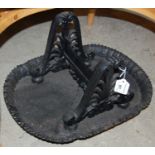 A cast-iron boot scrape cast with anthemion uprights