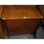 A small 19th century mahogany chest of two deep drawers raised on tapered square sectioned supports,