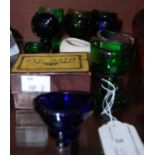 Collection of twelve assorted coloured glass eyebaths, to include one boxed example and one white