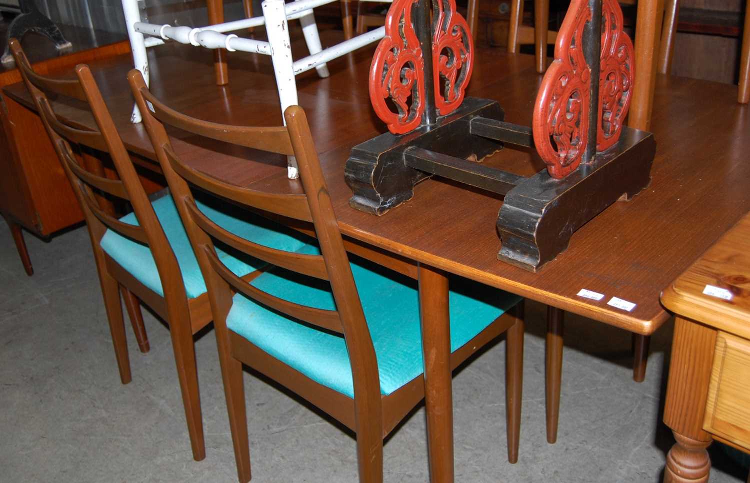 A mid 20th century teak dining room suite, comprising long sideboard, extending dining table and six - Image 2 of 3
