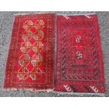 Two small Persian style rugs, one decorated with two octagonal-shaped medallions, approx. 103cm x