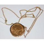 A 1974 gold Krugerrand in 9ct gold mount suspended from 9ct gold chain, gross weight 46.5 grams