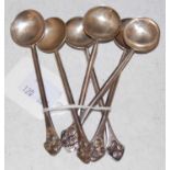 A set of six Scottish silver coffee spoons, Edinburgh, makers mark of 'N.C.', the terminals with