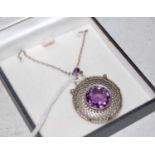 An Art Deco style white metal, marcasite and purple gem set pendant and chain