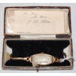A vintage 9ct gold case ladies wristwatch with yellow metal bracelet strap