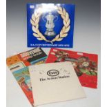 A scrapbook containing various cigarette cards, football cards, etc, together with a partially