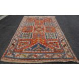 A Persian rug, 20th century, the abrashed orange ground decorated with square triangular and