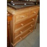 A pine chest of two short over three long graduated drawers