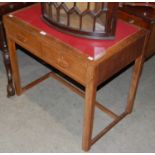 An early 20th century Art Deco style oak side table/ writing desk with red leatherette insert top