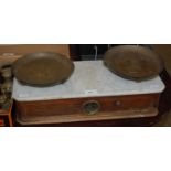 A set of antique Portee Scales with white marble top and box containing various brass weights