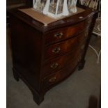 A reproduction mahogany serpentine chest of four long graduated drawers