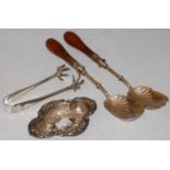 A silver quatrefoil-shaped bonbon dish, a pair of electroplated claw-shaped sugar tongs, and a