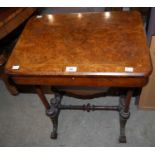 A Victorian walnut and boxwood lined work table