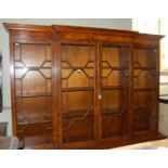 A reproduction breakfront Georgian style burr walnut bookcase, the upper section with four