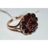 A vintage 9ct gold and garnet coloured glass flower cluster ring, ring size 'M', gross weight 3.7