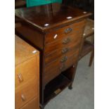 An Edwardian mahogany music cabinet fitted with five fall front drawers, bearing presentation plaque