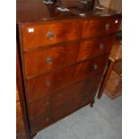 A reproduction mahogany chest of five long drawers on short cabriole legs