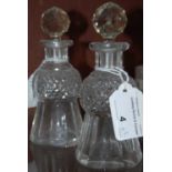 A pair of late 19th/ early 20th century cut glass thistle-shaped miniature decanters and stoppers,