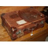 A vintage leather cupboard suitcase